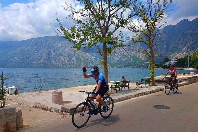 Bike tour - Kotor Bay circle and visit Our Lady of the Rock - The Kamenari ferry changes the pace