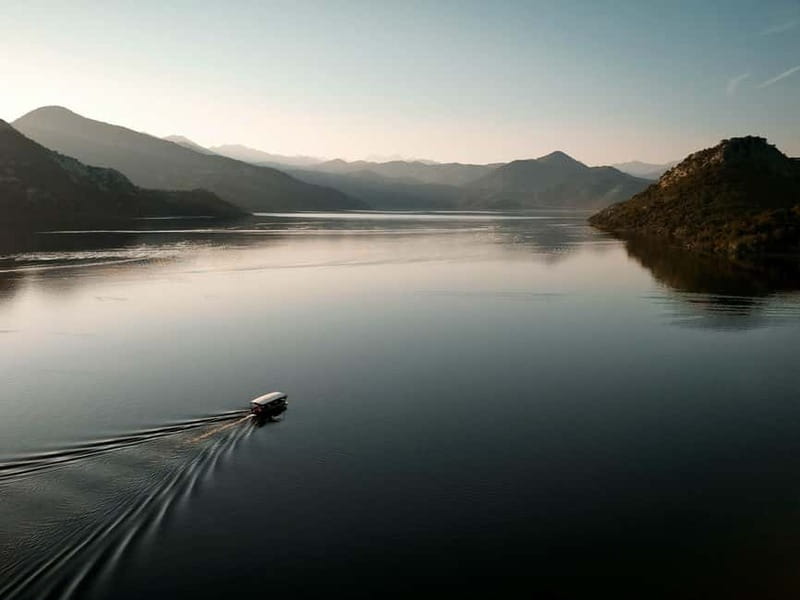 Skadar Lake: Guided Sunset Boat Tour with Wooden Boat & Wine - The gorice islands and narrow reed channels