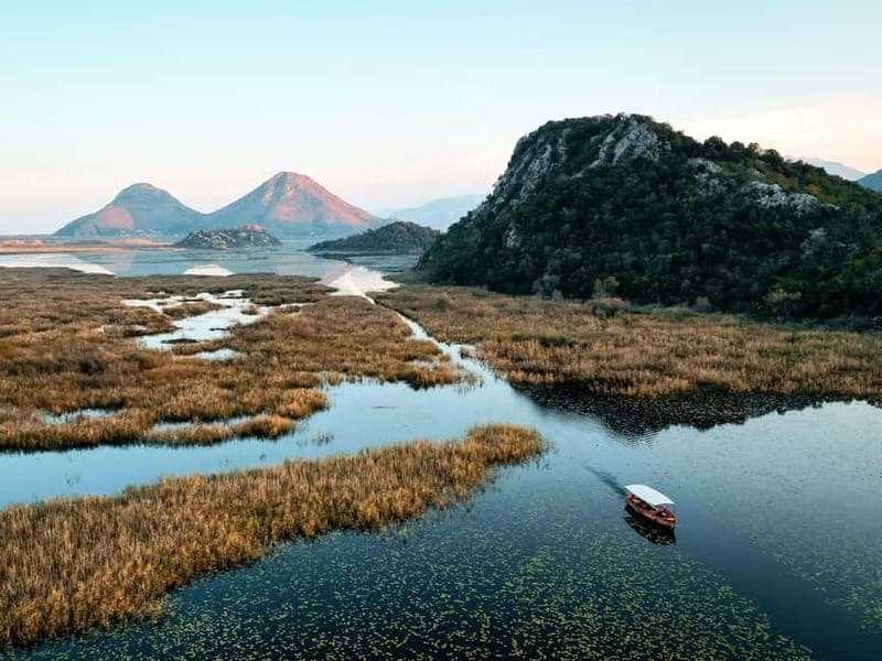 Skadar Lake: Guided Sunset Boat Tour with Wooden Boat & Wine - A short swim in the fresh lake water