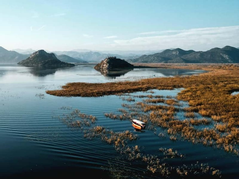 Skadar Lake: Guided Sunset Boat Tour with Wooden Boat & Wine - The return cruise and changing evening light